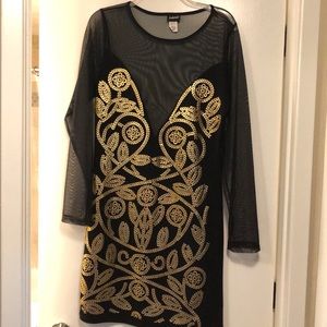 Exotic see through black and gold dress